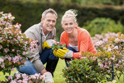 Group of gardeners in Limehouse collaborating with accessible tools and signage